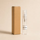 Sueño Blanco fragancia textil 5 ml de SimLi en frasco de vidrio junto a su caja kraft